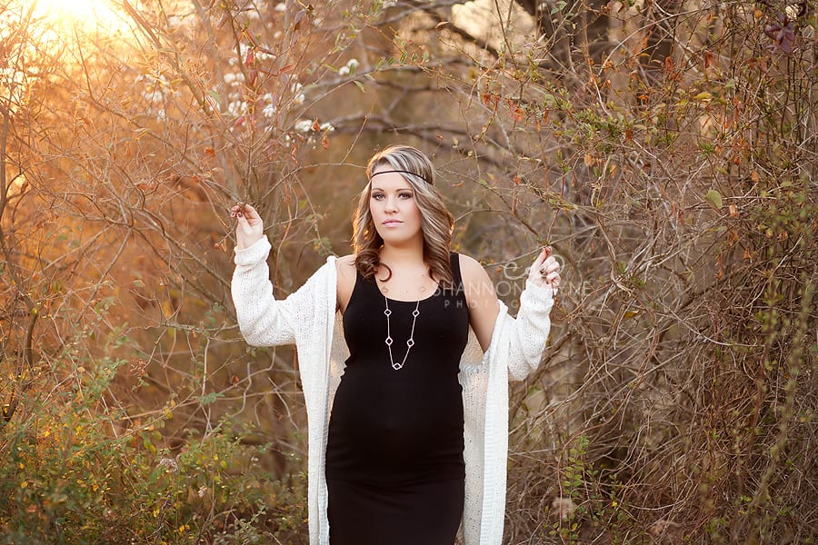 Maternity pose is forest at sunset, stunning boho maternity pose